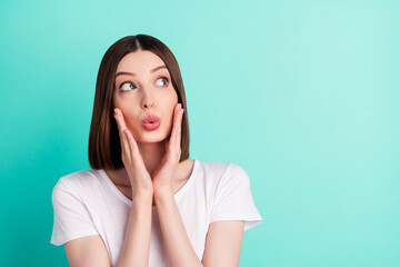 Portrait of attractive amazed worried girl oops copy space pout lips isolated over bright teal...