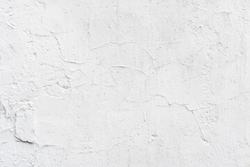 Texture of white painted wall, chipped, scratches. Stucco wall close-up