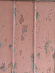 Texture of old painted rusty metal with faded peeling paint.