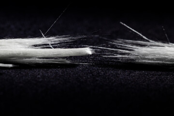 drastically broken real optical fiber on black background