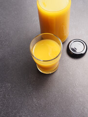 Organic orange juice on a stone table, view from above, healthy food concept