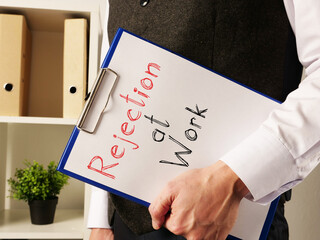Rejection at Work is shown on the business photo using the text