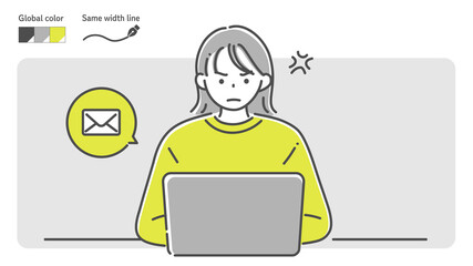 angry woman sending an email by laptop