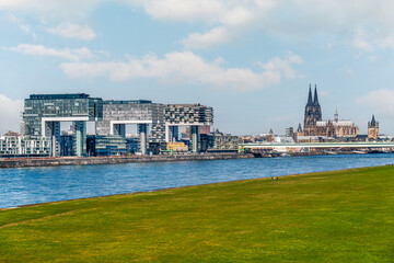 Obraz premium Cologne Koln, Germany, Panorama view of the Rhine River with Kranhaus Buildings, Rheinauhafen and Dom Cathedral