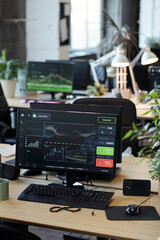 Computer monitor with graphic online information standing on desk