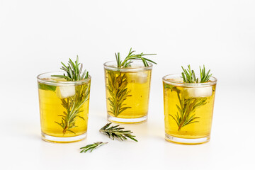 Summer cold tea and fresh herbs rosemary in glasses