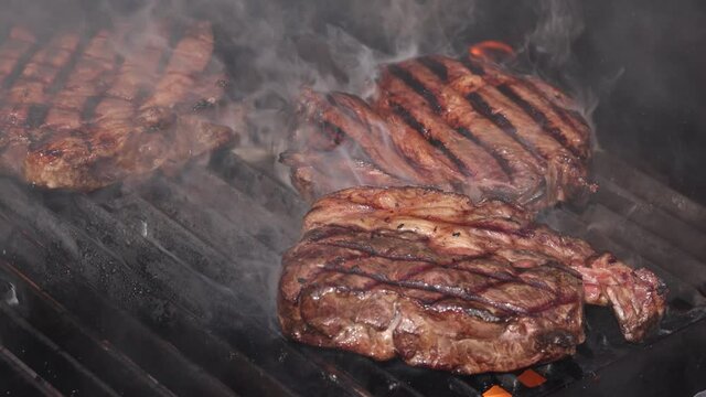 Searing and smoking ribeye steaks on grill