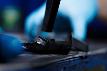 hands repairing laser toner cartridge