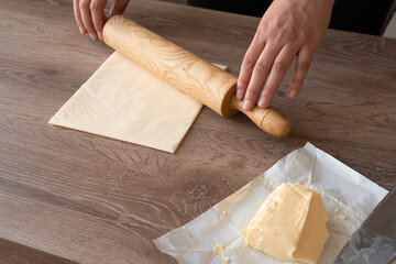 butter block, shape the butter. someone is rolling the butter. how to make laminated dough for...
