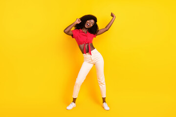 Fototapeta na wymiar Full length body size view of attractive cheerful dreamy girl dancing having fun isolated over bright yellow color background