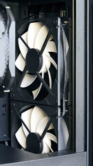 White cooling fans in computer system unit, close-up