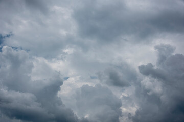 gray cumulus clouds at sky announcing a storm