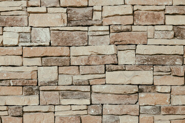 Mosaic stone rock sandstone puzzle tile texture pattern building exterior decoration wallpaper background.