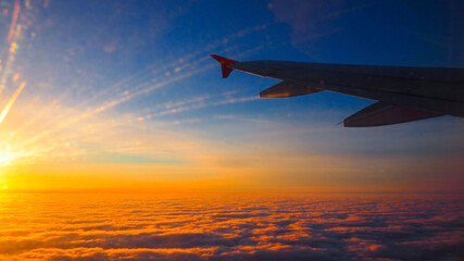 airplane in the sky at sunset