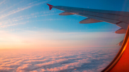Fototapeta premium airplane in the sky at sunset