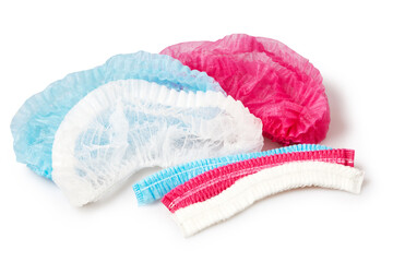 Blue, red and white medical surgical  non woven disposable caps isolated on white background with clipping path