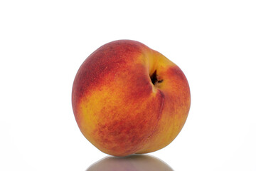 One ripe peache, close-up, isolated on white.