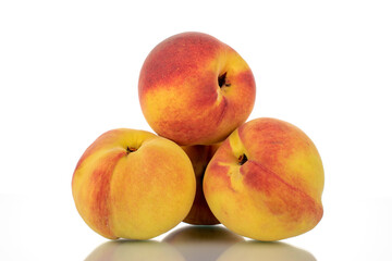 Several ripe peaches, close-up, isolated on white.