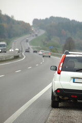 parked car on roadside of highway