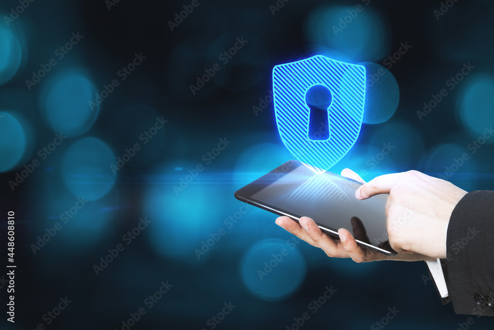Aufkleber close up of male hands holding tablet with abstract digital padlock on blue background with mock up 