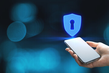Close up of woman hands holding smartphone with abstract digital padlock on blue background with mock up place. Online safety and web protection concept.