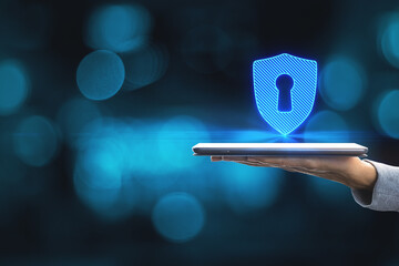 Close up of female hands holding smartphone with abstract digital padlock on blue background with mock up place. Online safety and web protection concept.