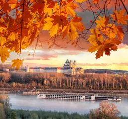 Fototapeten Panorama of Melk abbey with Danube river and autumn forest in Austria © Tomas Marek