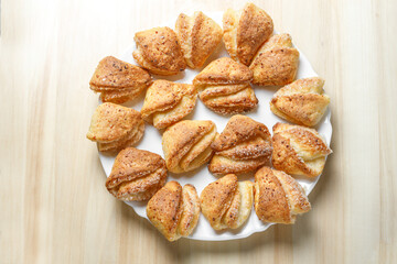 Freshly prepared pastries with a crispy crust are on a plate.