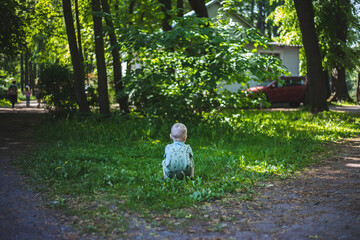 Fototapeta premium Child in green grass