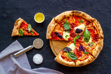 Margherita italian pizza with tomatoes cheese and basil, top view