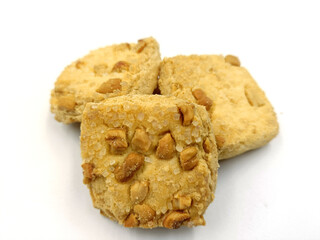 Home made sweet biscuits with mixed nuts on white background
