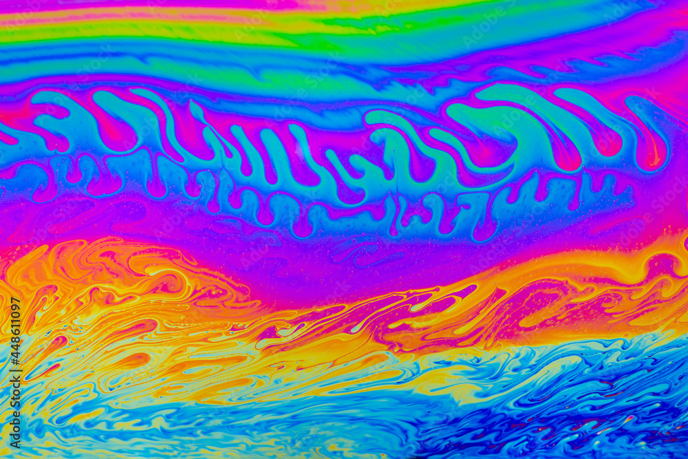 Wall mural rainbow colors. psychedelic multi colored patterns background. photo macro shot of soap bubbles