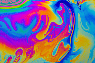 Rainbow colors. Psychedelic multi colored patterns background. Photo macro shot of soap bubbles