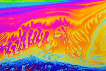 Rainbow colors. Psychedelic multi colored patterns background. Photo macro shot of soap bubbles