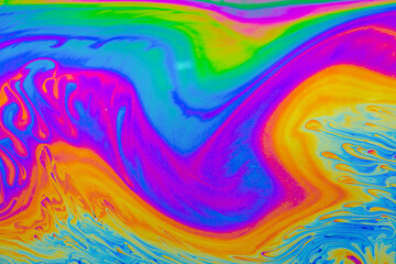 Fototapeta na wymiar Rainbow colors. Psychedelic multi colored patterns background. Photo macro shot of soap bubbles