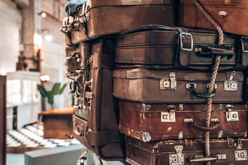 Vintage Pile Ancient Suitcases Form of Tower Design Concept Travel Luggage. Beautiful travel background.