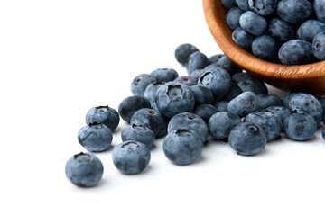 Blueberry in wooden bowl isolated on white background.