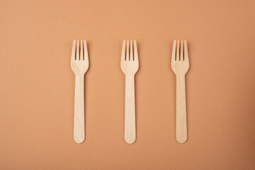 Eco friendly kitchen items . Zero waste and plastic free concept. Forks in top view on beige background. Disposable tableware. Natural products for recycle .