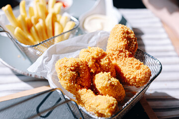 fast food. chicken wings in crispy batter. delicious and juicy appetizing food in a fast food cafe