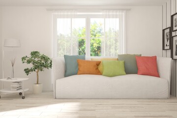 White living room with sofa and summer landscape in window. Scandinavian interior design. 3D illustration