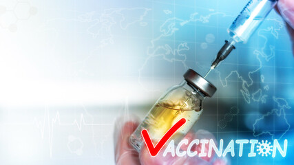 vaccination closeup vaccine and syringe in doctor's hand with place for text concept vaccination...