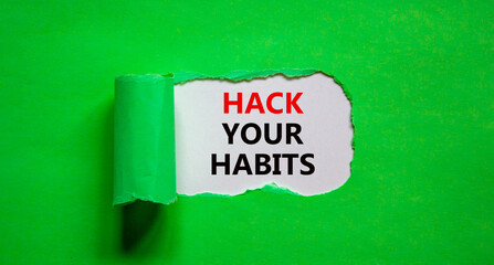 Hack your habits symbol. Words 'Hack your habits' appearing behind torn green paper. Beautiful...