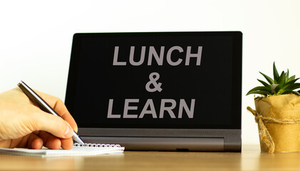 Lunch and learn symbol. Tablet with words 'Lunch and learn'. Businessman hand with pen, house...