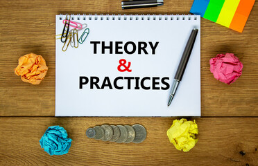 Theory and practice symbol. Words 'Theory and practice' on white note. Wooden table, colored paper, paper clips, pen, coins. Business, theory and practice concept. Copy space.