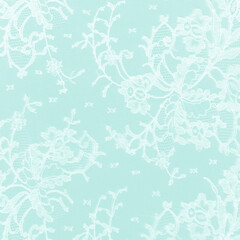 Mint green lace fabric with a floral ornament. A feminine background best for invitations or wedding designs.