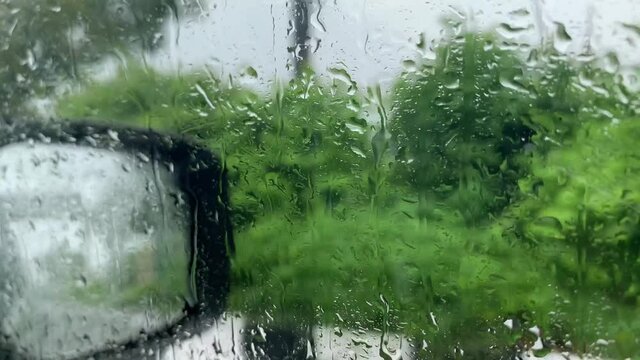 Rainy season, Driving in rain, Rainy drops on windscreen, Waterlogged