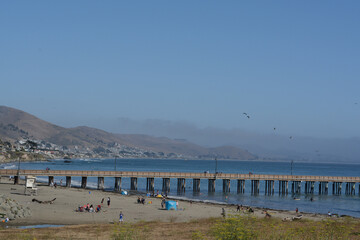 The Cayucos Pier on Cayucos State Beach at Estero bay on the Pacific Ocean in Cayucos, San Luis Obispo County, California