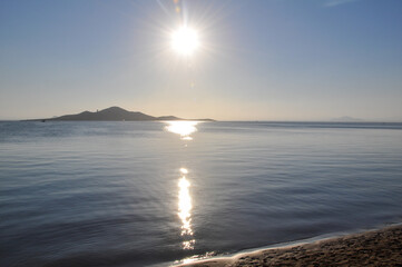 Sun over the water Mar Menor in La Manga, Murcia with view for Isla del Barón