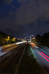 view of the center of warsaw at night, light show, completion of the construction of the skysawa skyscraper