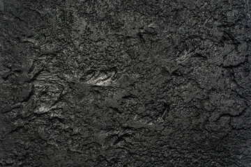 Background of an old black concrete wall.